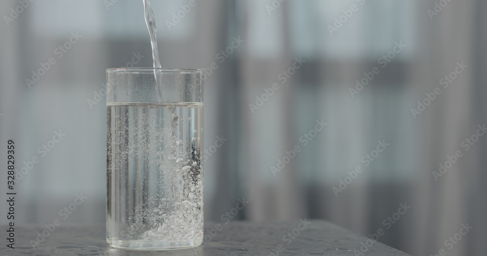 pour soda into glass on concrete surface pour soda into glass on concrete surface