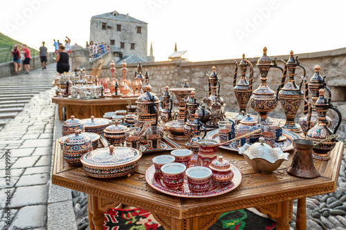 Decorative souvenirs and handicrafts for sale on the Stari Most bridge in Old Town of Mostar BiH photo