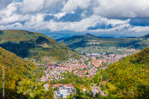 Traditional picturesque green valley of Swabian Alps, Europe, with small German town, view from cliff of Ghotic castle Lichtenstein