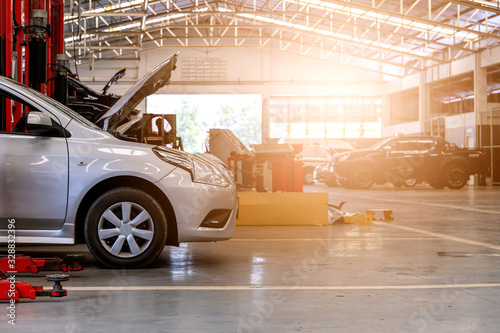 car in repair station and body shop with soft-focus and over light in the background
