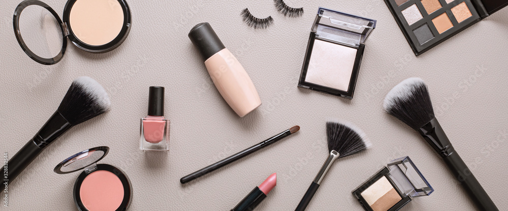 Flat lay with set of professional decorative cosmetics, makeup tools and woman accessories over gray background with copy space. Beauty blog, fashion, party and shopping concept - obrazy, fototapety, plakaty 