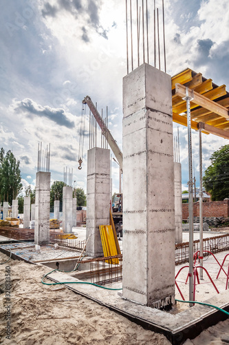 Concrete columns and construction crane