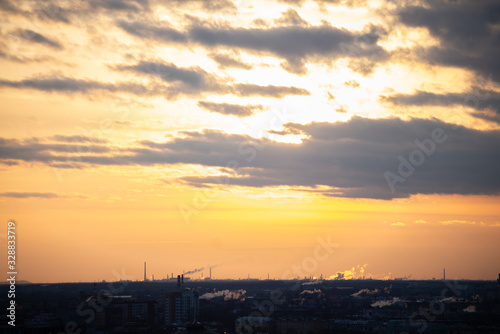 sunset over the industrial part of the city