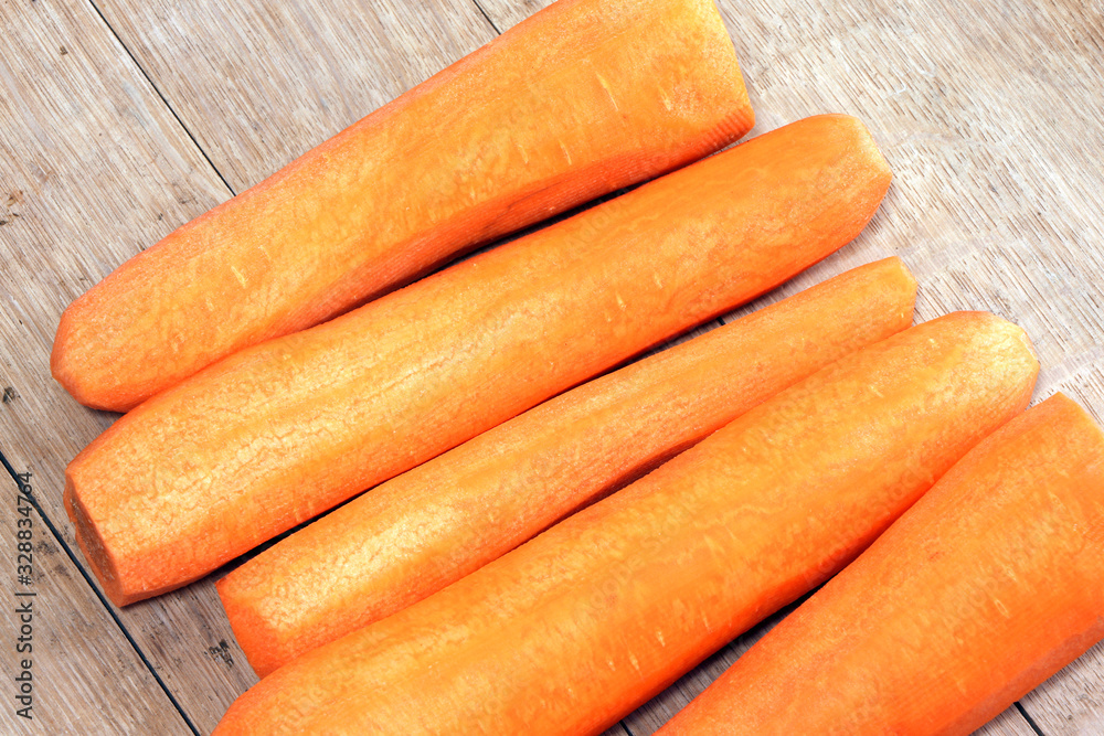 Fresh carrot on a wooden table. Healthy, vegetarian food. Vegetables. Fresh carrot on a wooden table. Healthy, vegetarian food. Vegetables.