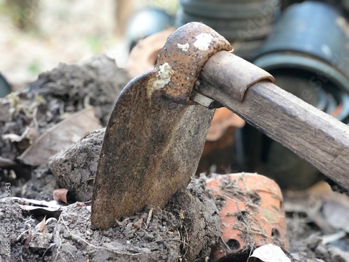 Close-Up Old steel hoe on a pile of soil, Agriculture tool for planting