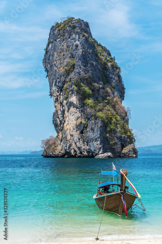 Thai traditional wooden longtail boat and beautiful sand beach at Koh Poda island in Krabi province.  Ao Nang, Thailand ,Krabi island is a most popular tourist destination in Thailand © TeTe Song