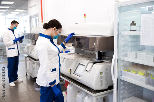 Wallpaper Mural Female scientist doing molecular allergy diagnostics in lab Torontodigital.ca