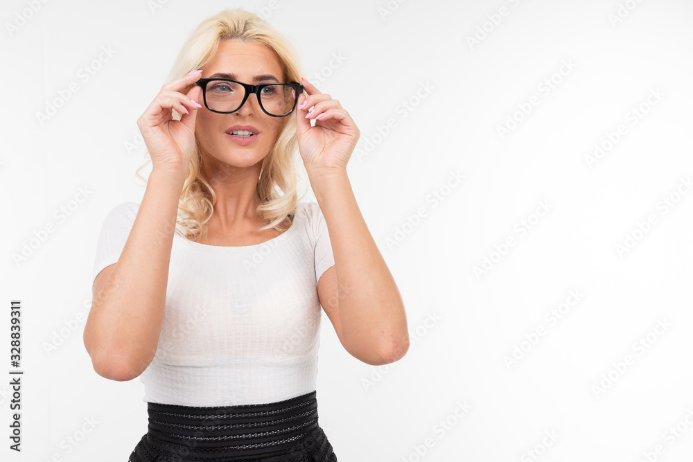 girl stares intently in glasses for vision on a white background with copy space