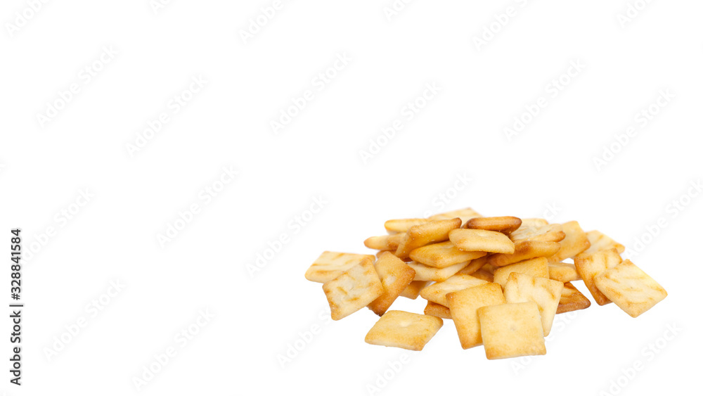 Square mini salted crackers, snack food. Isolated on white. Square mini salted crackers, snack food. Isolated on white.