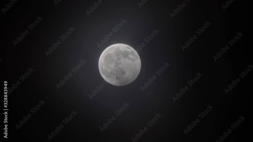 full moon moving between clouds, timelapse, 4k