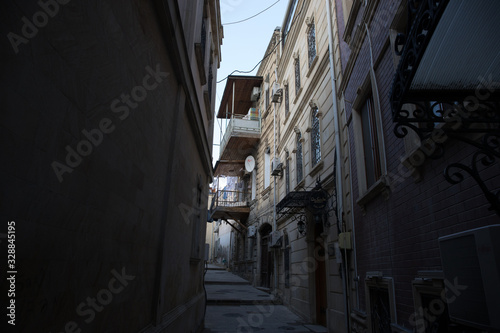 Fototapeta Naklejka Na Ścianę i Meble -  Empty street in old city of Baku, Azerbaijan. Old city Baku. Inner City buildings.