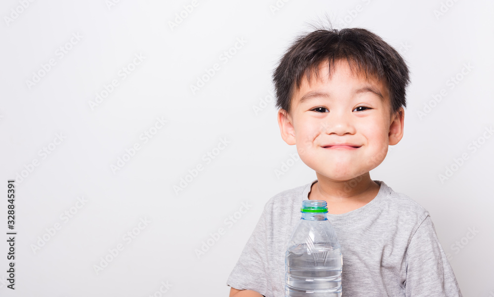 Closeup Asian face, Little children boy drinking water from Plastic bottle Closeup Asian face, Little children boy drinking water from Plastic bottle
