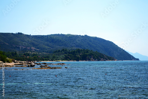 Ouranopolis coast. Landscape of a beach in ancient town Uranopolis near Mount Athos, Halkidiki, Greece. © Sulugiuc