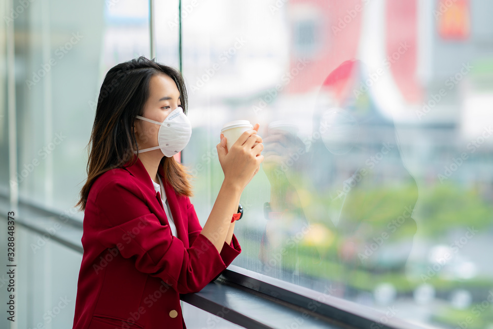 Asian girl use a protection mask for prevent PM 2.5 and corona viruus or covic 19