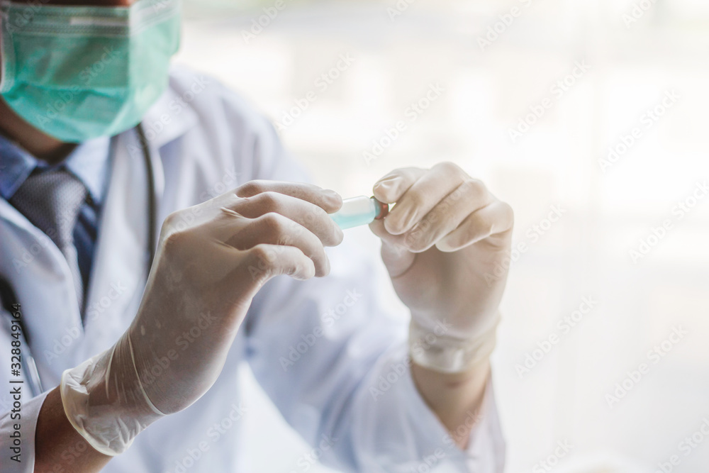 The medical team wore a coronavirus protective suit and rubber gloves to examine the coronavirus covid-19 and research for a vaccine to prevent coronavirus covid-19 to stop the epidemic. The medical team wore a coronavirus protective suit and rubber gloves to examine the coronavirus covid-19 and research for a vaccine to prevent coronavirus covid-19 to stop the epidemic.