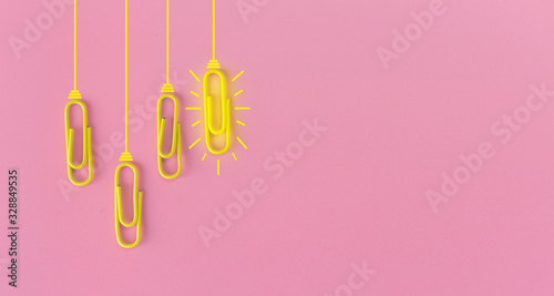 Great ideas concept with paperclip,thinking,creativity,light bulb on blue background,new ideas concept. © A Stockphoto