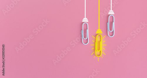 Great ideas concept with paperclip,thinking,creativity,light bulb on blue background,new ideas concept. © A Stockphoto