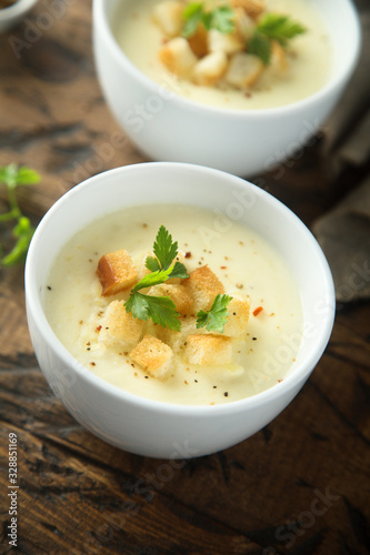 Homemade cheese soup with bread croutons