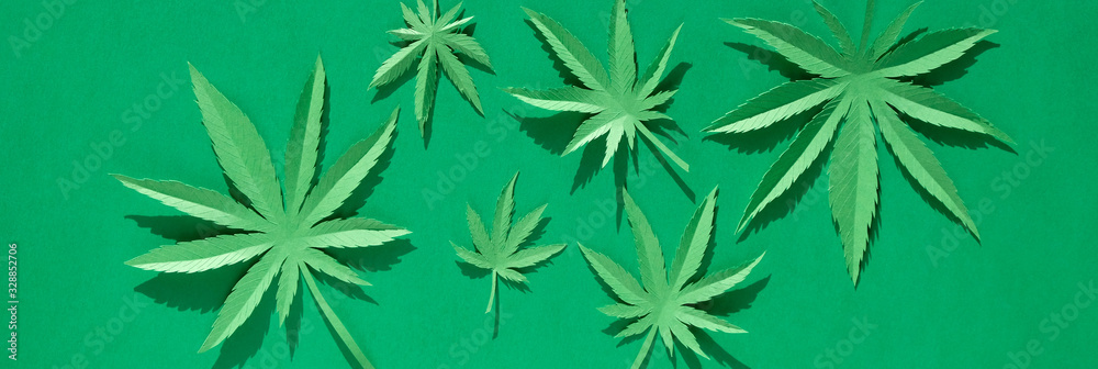 Cannabis leaf made of paper on green background Cannabis leaf made of paper on green background