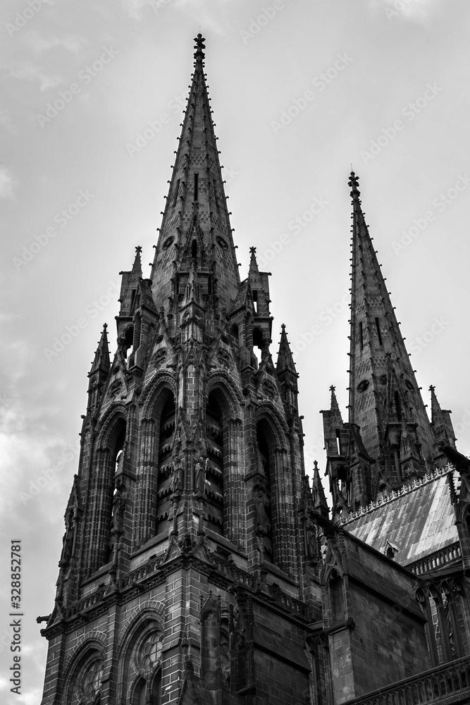 Black and white, artistic, beautiful view of impressive cathedral of Clermont Ferrand in France, made from dark volcanic rocks