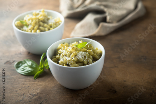 Pasta with pesto sauce and cheese