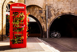 Traditional english telephone box with flowers. Bath, England, UK.
