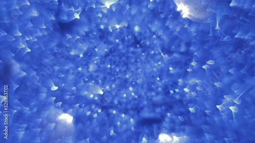 Blinking, glittering and sparkling blue bokeh lights inside the New Year or Christmas light ball in night illumination