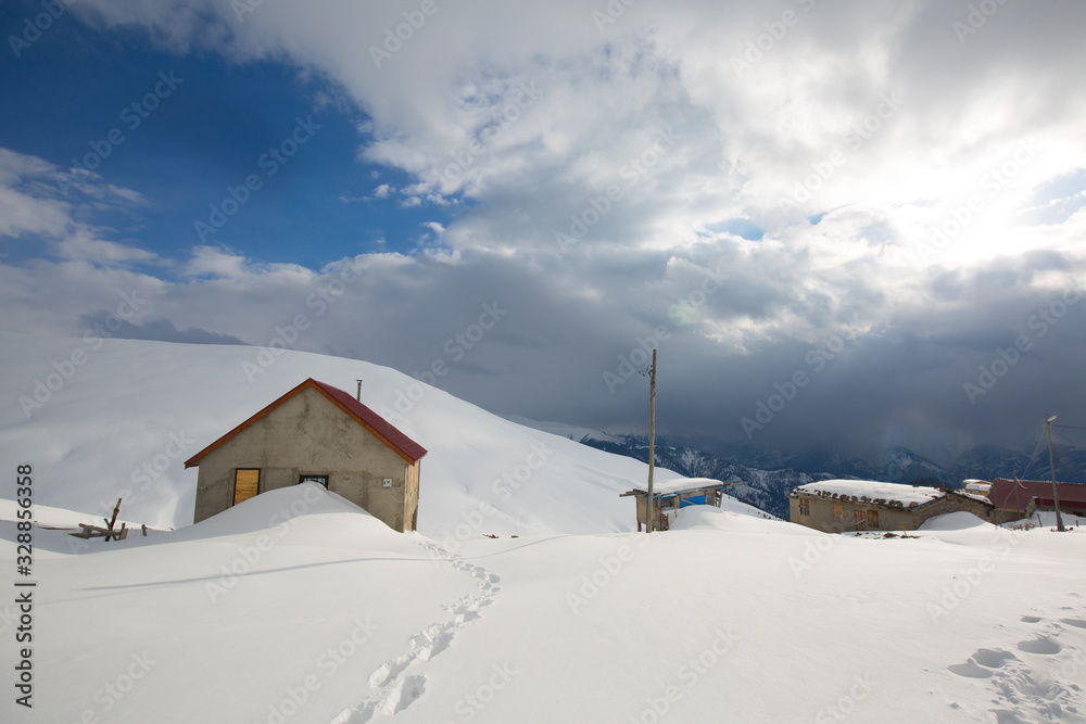 highland houses in snowy mountains in turkey rize