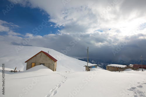 highland houses in snowy mountains in turkey rize © hacimatrix