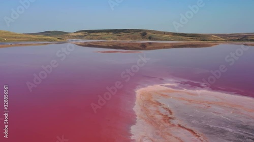 Aerial view of pink lake - Chokrak lake in Karalarsky park, Crimea, 4k photo