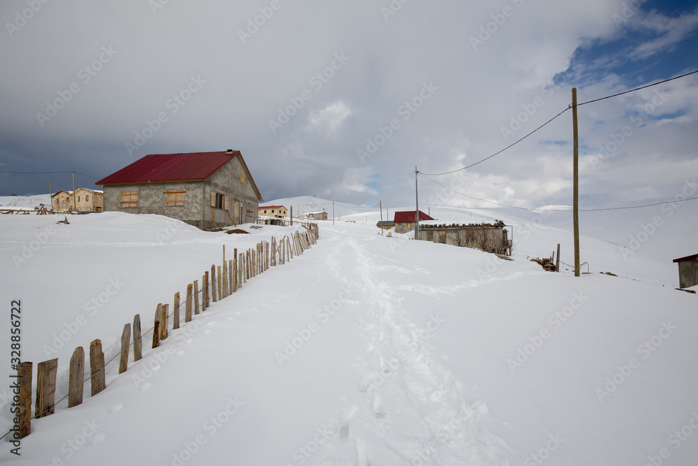 highland houses in snowy mountains in turkey rize