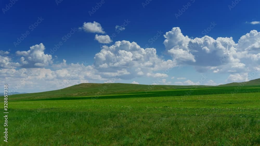 Green hill with grass under cloudy sky, timelapse 4k Green hill with grass under cloudy sky, timelapse 4k
