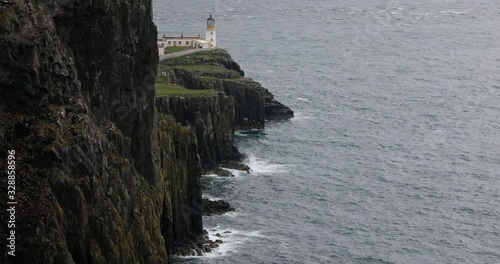 Ancient Scottish lighthouse on cape. 4K Footage.