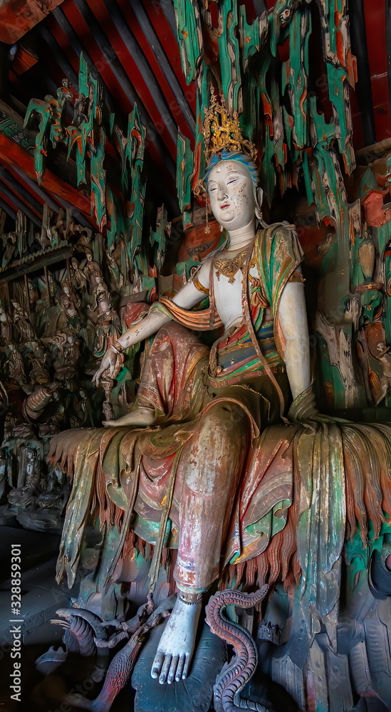 Supreme wood carving of bodhisatta statue. Avalokitesvara sculpture. Finest chinese art at Shuanglin Temple (or Zhongdu Temple), outskirts Pingyao Old City, Shanxi province, China