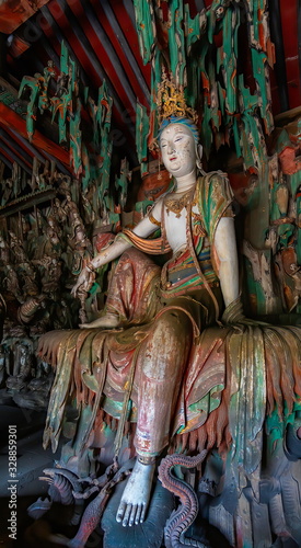 Supreme wood carving of bodhisatta statue. Avalokitesvara sculpture. Finest chinese art at Shuanglin Temple (or Zhongdu Temple), outskirts Pingyao Old City, Shanxi province, China