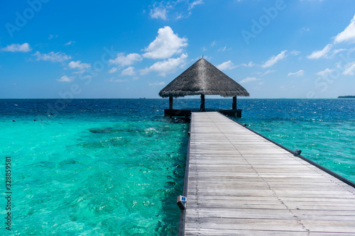 Maldives  Kaafu atoll - December 27 2019 - A wooden pier towards a Maldivian stilt house