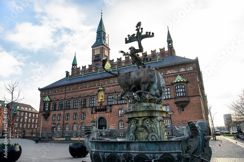 Fountain with bronze sculpture of bull and dragon on City Hall Square in Copenhagen, Denmark. February 2020 photo