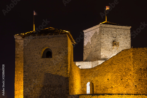 Beautiful golden lights on the walls and towers of ancient Momcilov grad fortress in Pirot photo