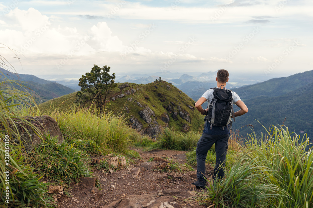Young man hiking the mountains in Sri Lanka