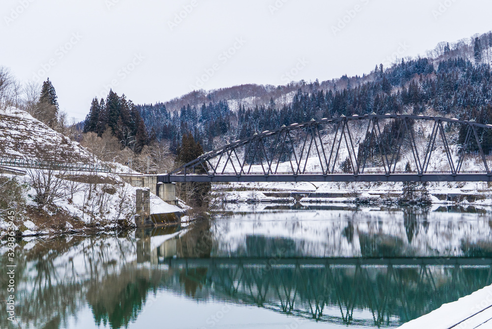 Fototapeta premium Bridge and river in winter season