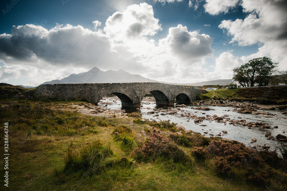 Ancient bridge overlooking the Sligachan mountains of the Scottish highlands