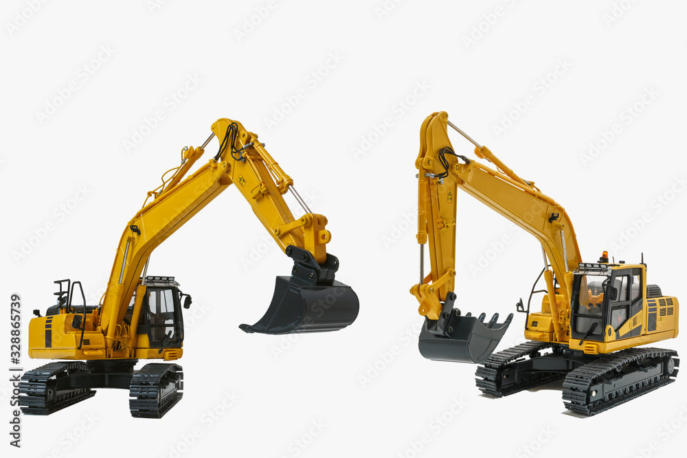 Two yellow excavator model design with isolated on a white background Two yellow excavator model design with isolated on a white background