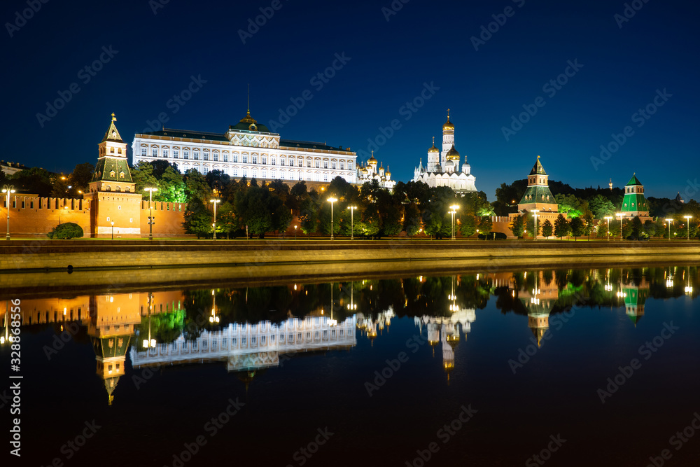 Moscow. Russia. Reflection of the Kremlin buildings in the Moscow river. Evening in the capital of Russia. Lighting of the Kremlin embankment. Business card of Moscow. Capital of Russia.