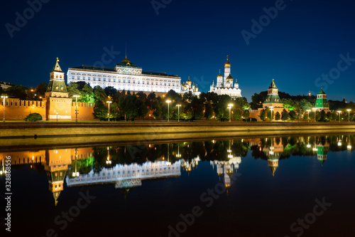 Moscow. Russia. Reflection of the Kremlin buildings in the Moscow river. Evening in the capital of Russia. Lighting of the Kremlin embankment. Business card of Moscow. Capital of Russia.