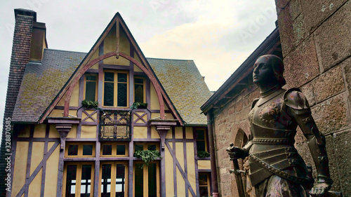 Fototapeta Naklejka Na Ścianę i Meble -  sculpture in front of the church in mont saint michel in france