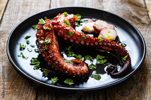 Barbecue octopus on wooden table