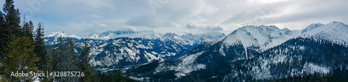 Panorama of snow-capped mountains, snow and clouds on the horizon © Bogdan