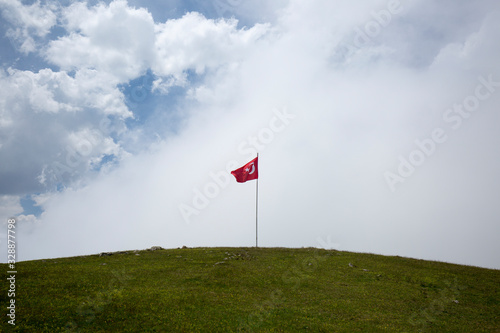 turkish flag sky clouds and grass