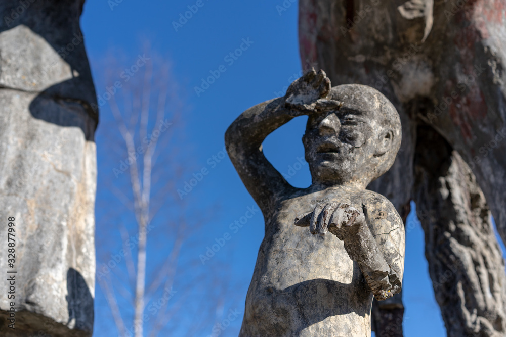 Ancient monument in the afternoon, frightened boy