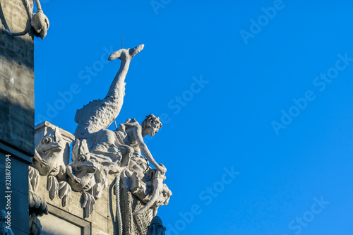 A close up on a mermaid and frogs on the rooftop of House with Chimaeras/Horodecki House build in Art Nouveau style in Kiev, Ukraine. House is decorated with various animals like snakes, eagles, rhino